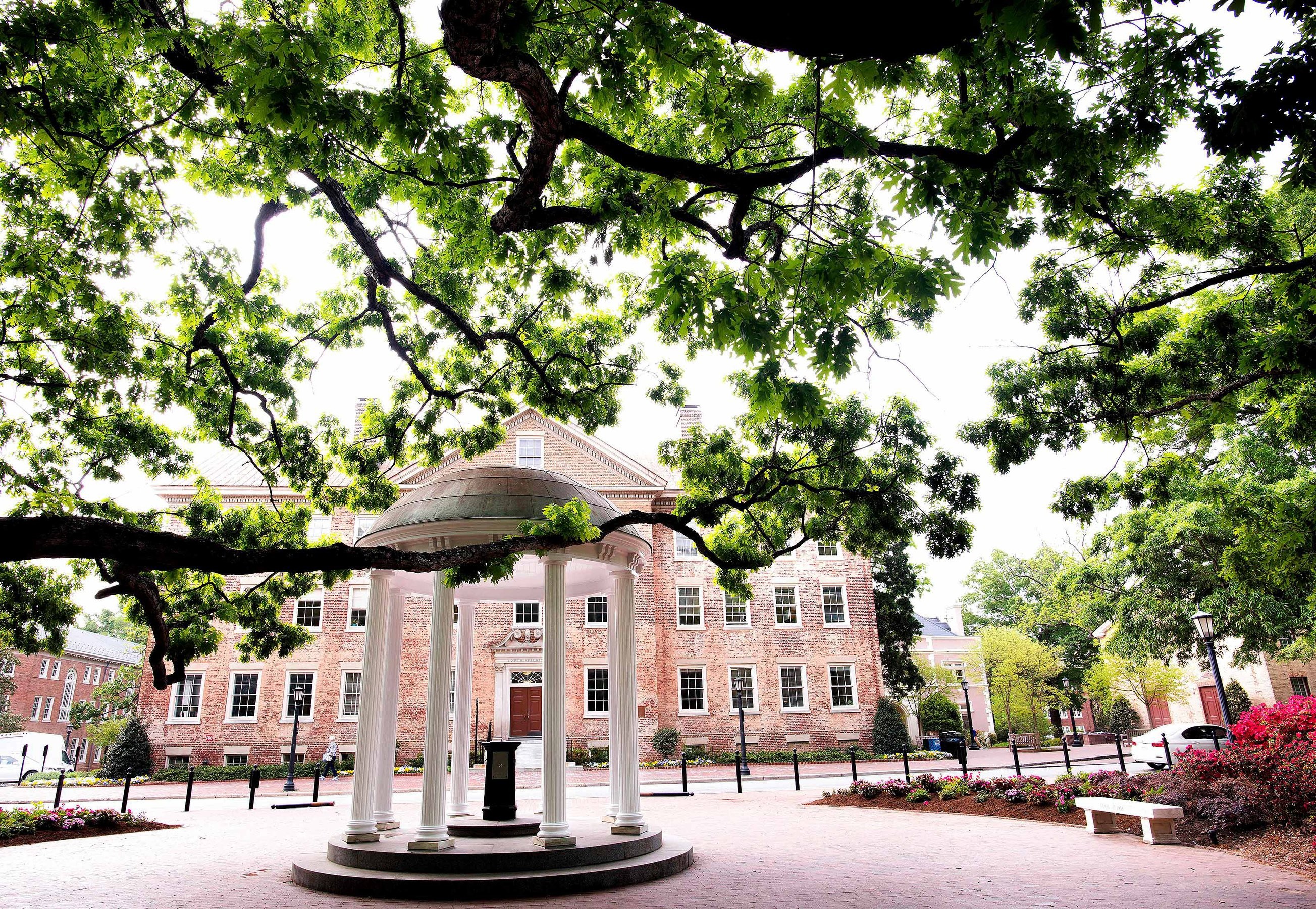 UNC Chapel Hill's Old Well inside the gazebo near a line of tree branches