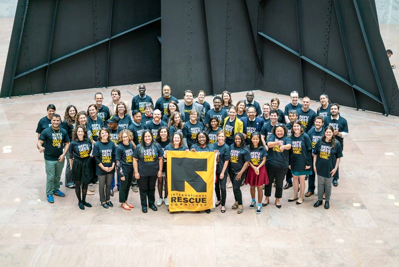 A group photo of International Rescue Committee employees wearing 