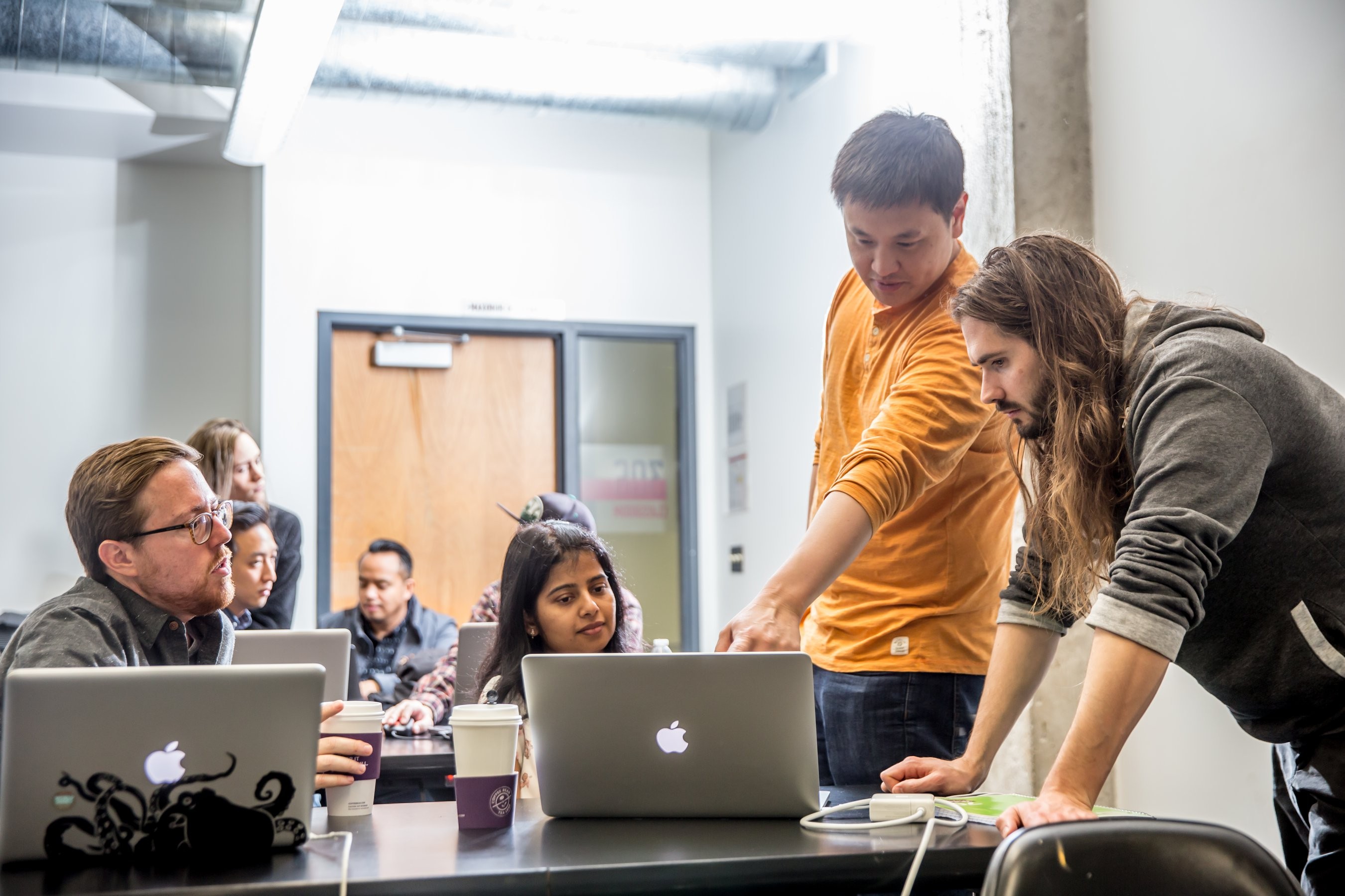 Instructor working with students