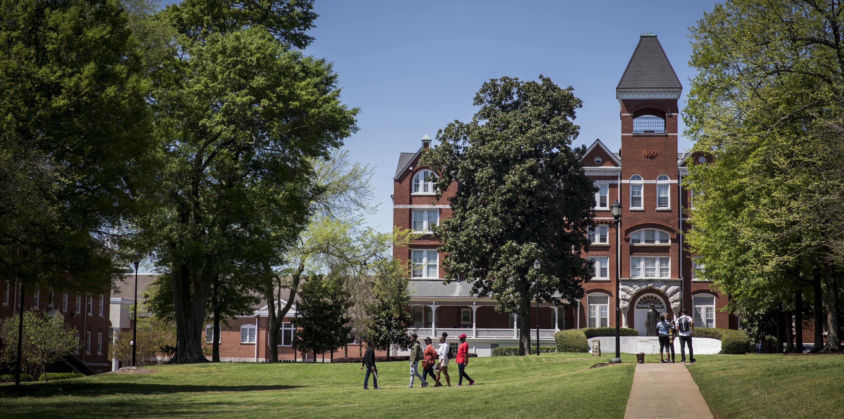 Students walking on the quad on a sunny day at Morehouse College